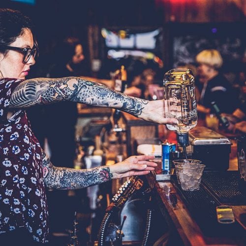 Bartender pouring drinks